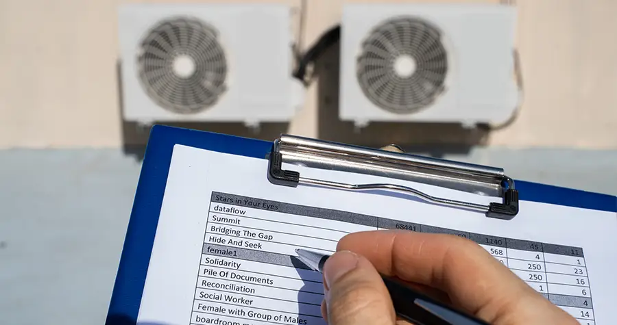 A man documenting on a clipboard